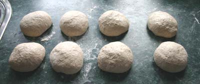 The dough halved and rounded into eight pieces